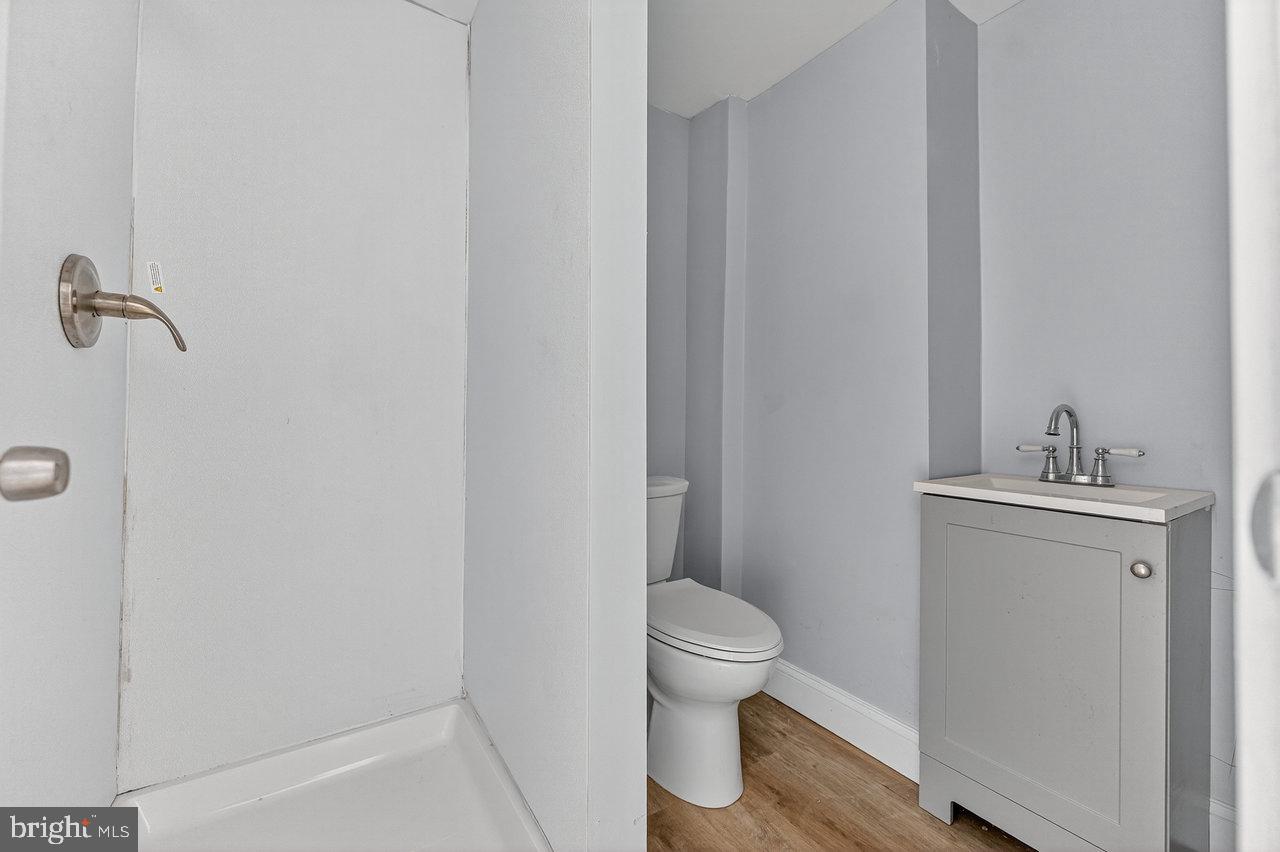 11 North Willow Street, Unit 3 Trenton, NJ 08608 - Photo 5 of 8 a white toilet sitting next to a bathroom sink