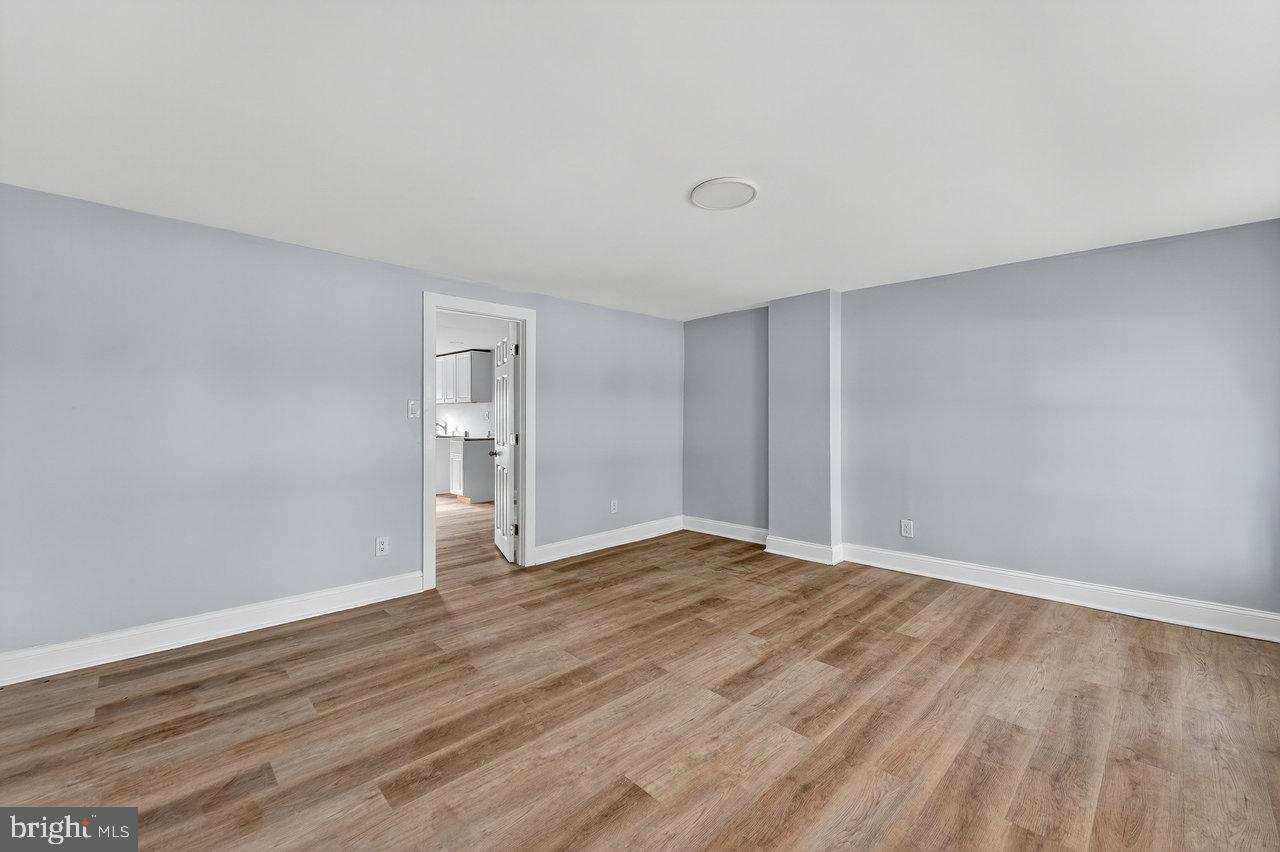 11 North Willow Street, Unit 3 Trenton, NJ 08608 - Photo 8 of 8 a view of an empty room with wooden floor and a window