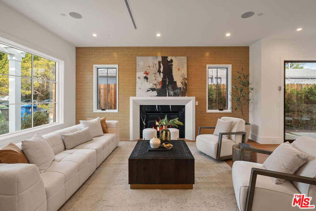 1742 Preuss Road Los Angeles, CA 90035 - Photo 2 of 50 a living room with furniture and a fireplace