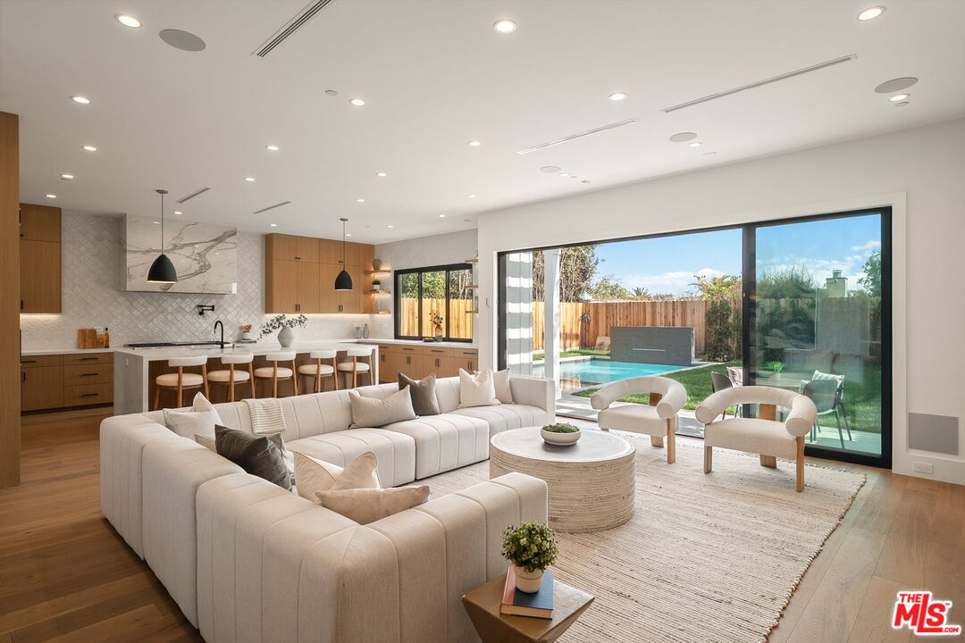 1742 Preuss Road Los Angeles, CA 90035 - Photo 21 of 50 a living room with furniture and a large window