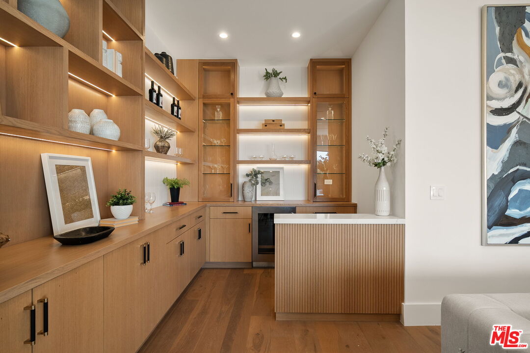 1742 Preuss Road Los Angeles, CA 90035 - Photo 23 of 50 a kitchen with stainless steel appliances granite countertop a stove a sink and a refrigerator