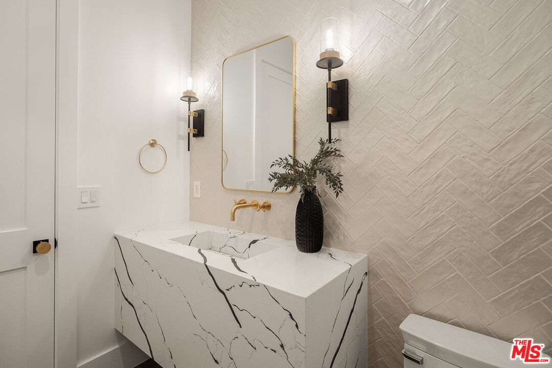 1742 Preuss Road Los Angeles, CA 90035 - Photo 24 of 50 a bathroom with a sink and vanity