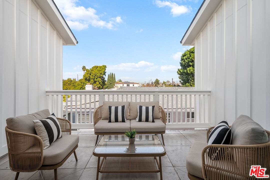 1742 Preuss Road Los Angeles, CA 90035 - Photo 26 of 50 a living room with furniture and a potted plant