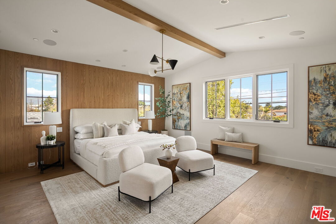 1742 Preuss Road Los Angeles, CA 90035 - Photo 27 of 50 a bedroom with a bed and wooden floor