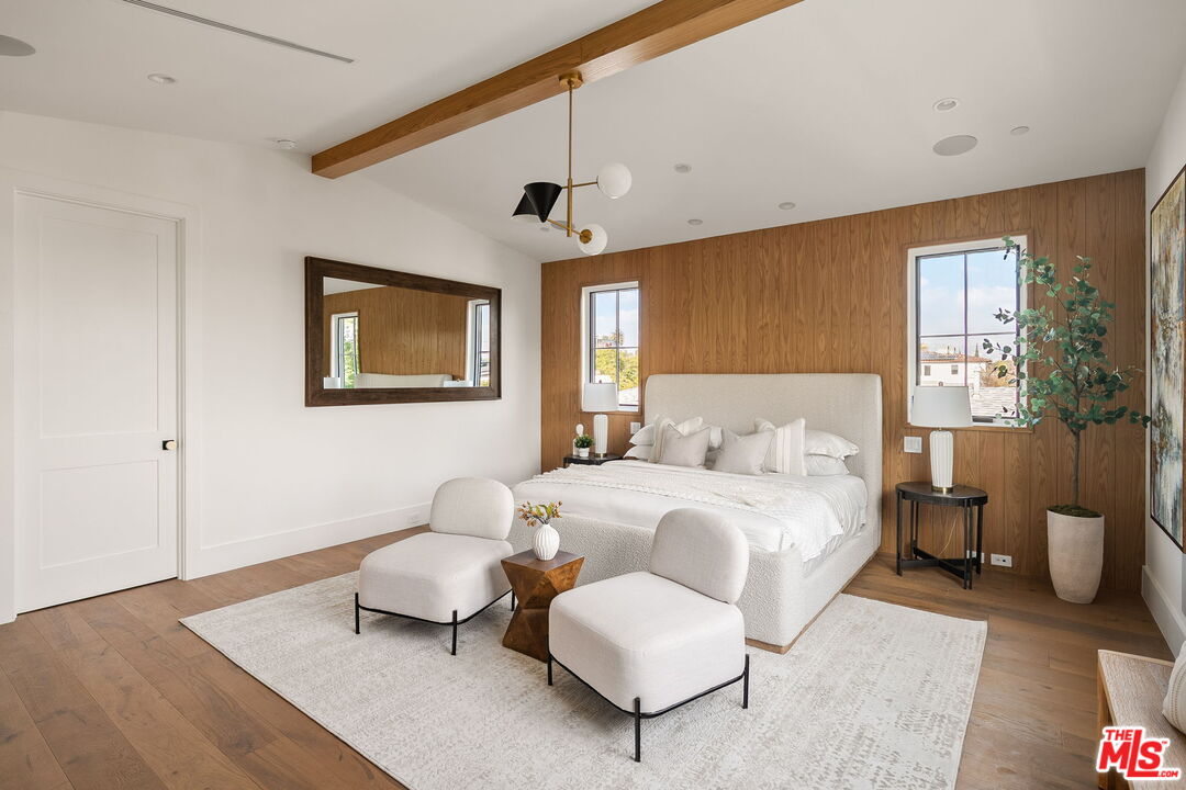 1742 Preuss Road Los Angeles, CA 90035 - Photo 29 of 50 a bedroom with a bed and wooden floor