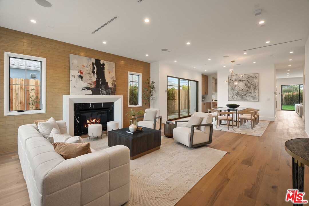 1742 Preuss Road Los Angeles, CA 90035 - Photo 3 of 50 a living room with fireplace furniture and a large window