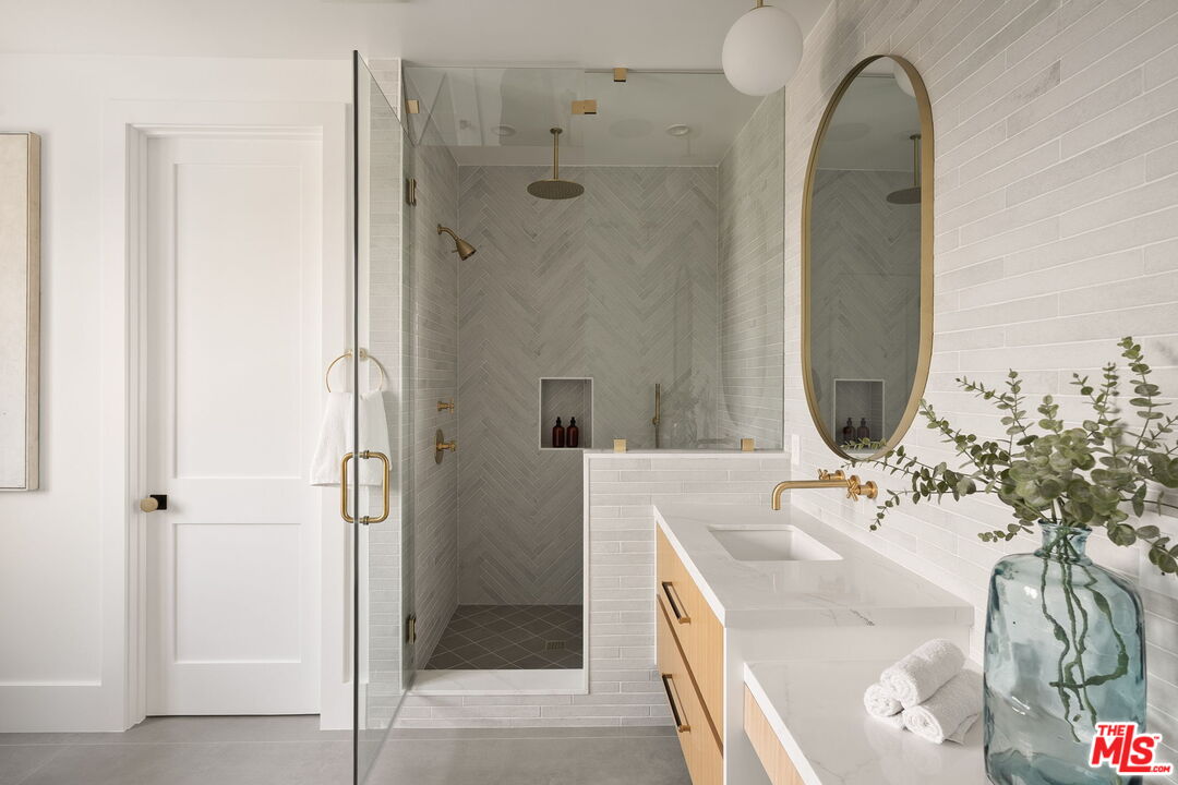 1742 Preuss Road Los Angeles, CA 90035 - Photo 32 of 50 a bathroom with a sink and a mirror