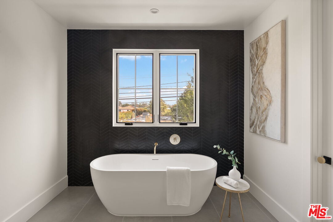 1742 Preuss Road Los Angeles, CA 90035 - Photo 33 of 50 a white bath tub sitting in a bathroom next to a window