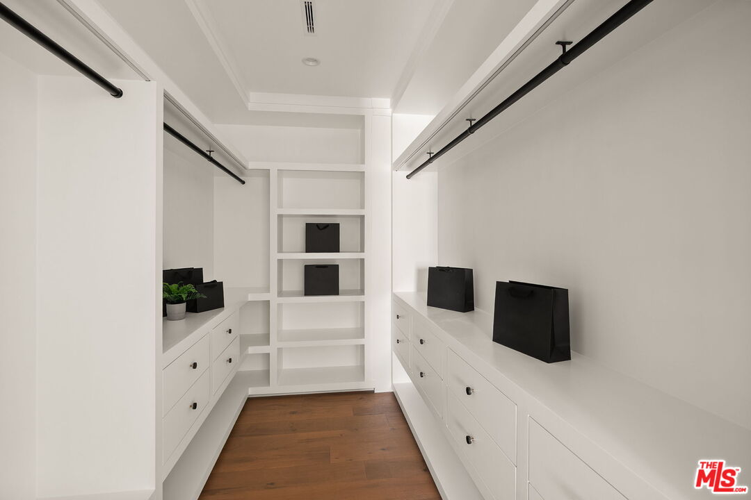 1742 Preuss Road Los Angeles, CA 90035 - Photo 35 of 50 a kitchen with white cabinets and white appliances