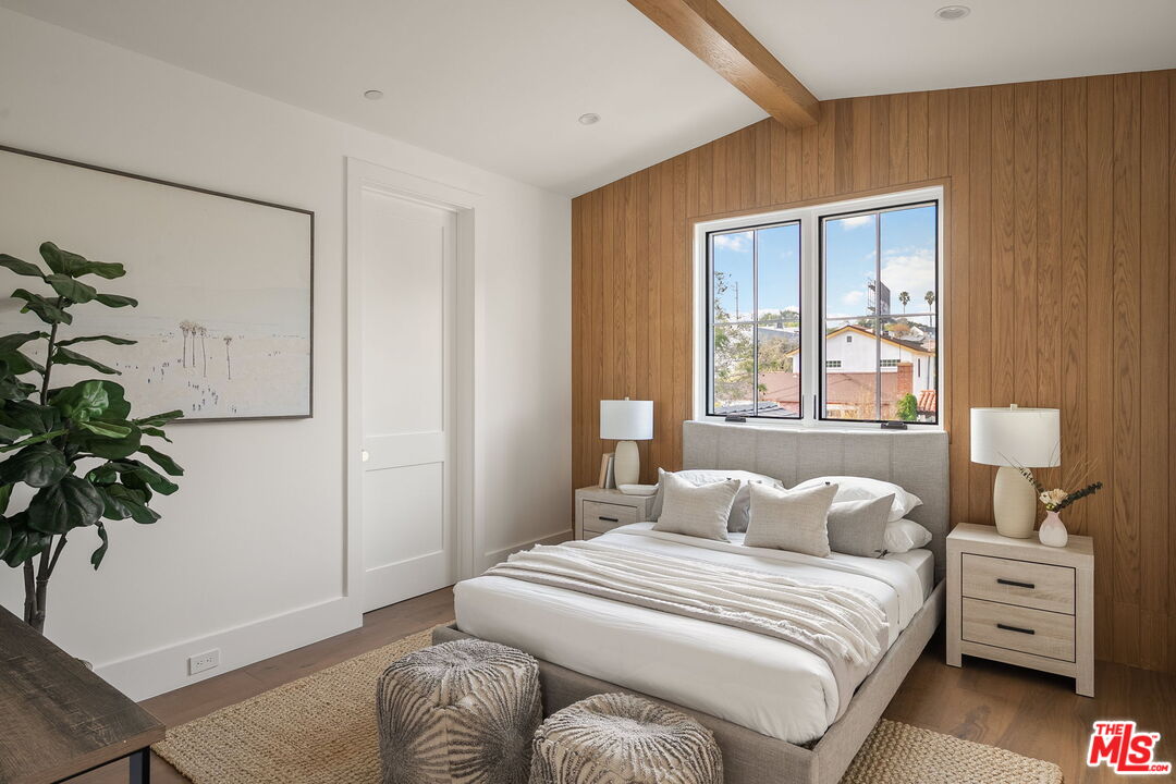 1742 Preuss Road Los Angeles, CA 90035 - Photo 39 of 50 a bedroom with a bed and a potted plant