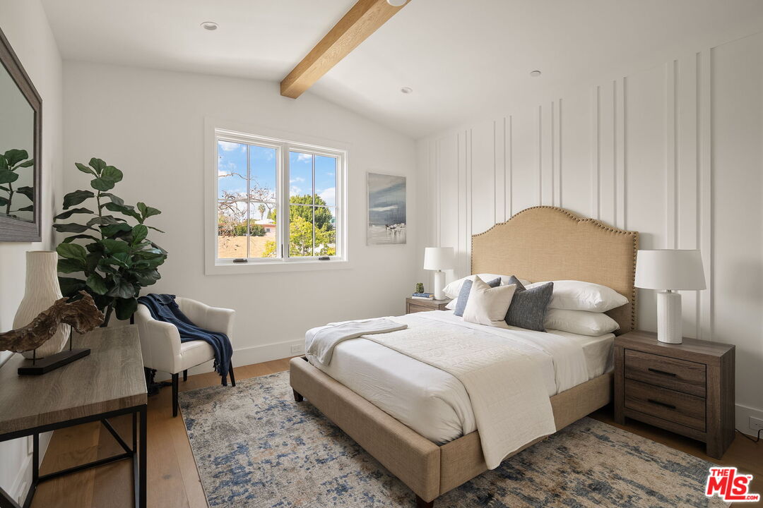 1742 Preuss Road Los Angeles, CA 90035 - Photo 43 of 50 a bedroom with bed and a potted plant