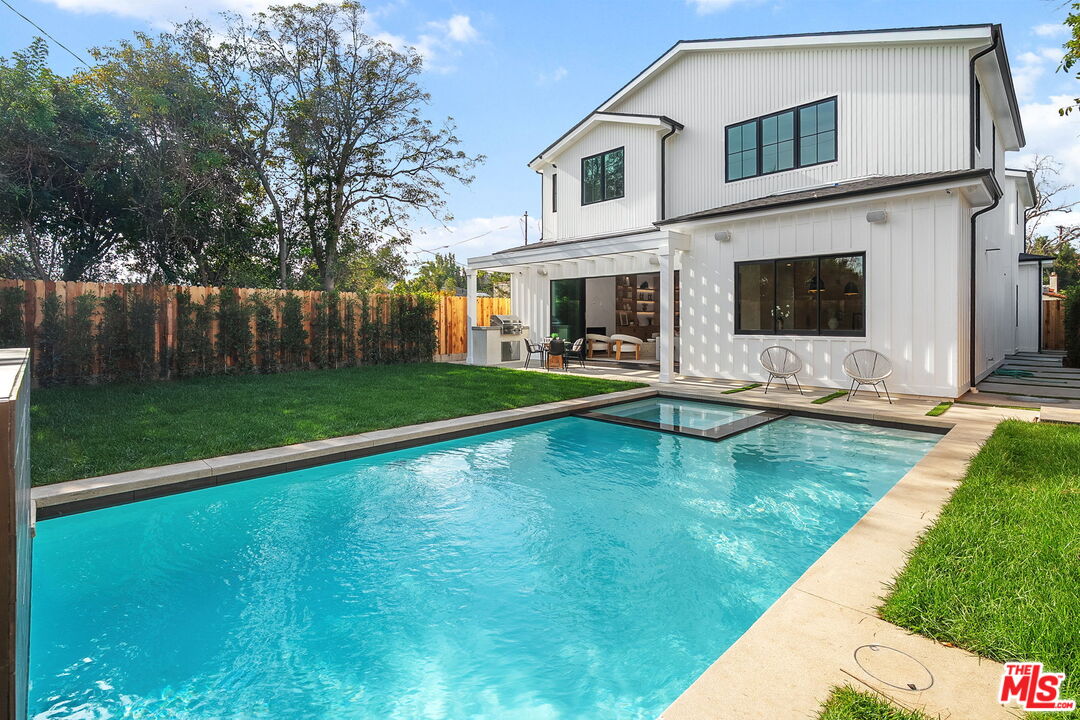 1742 Preuss Road Los Angeles, CA 90035 - Photo 48 of 50 a swimming pool with wooden fence