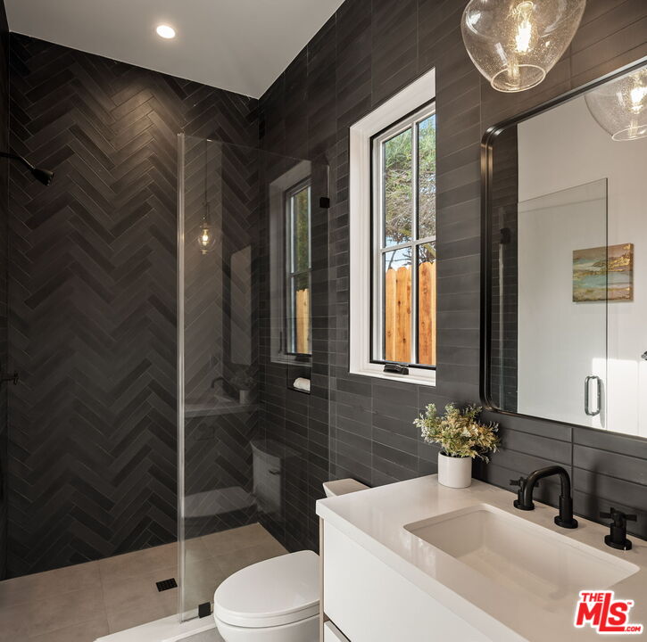 1742 Preuss Road Los Angeles, CA 90035 - Photo 8 of 50 a bathroom with a sink toilet and shower