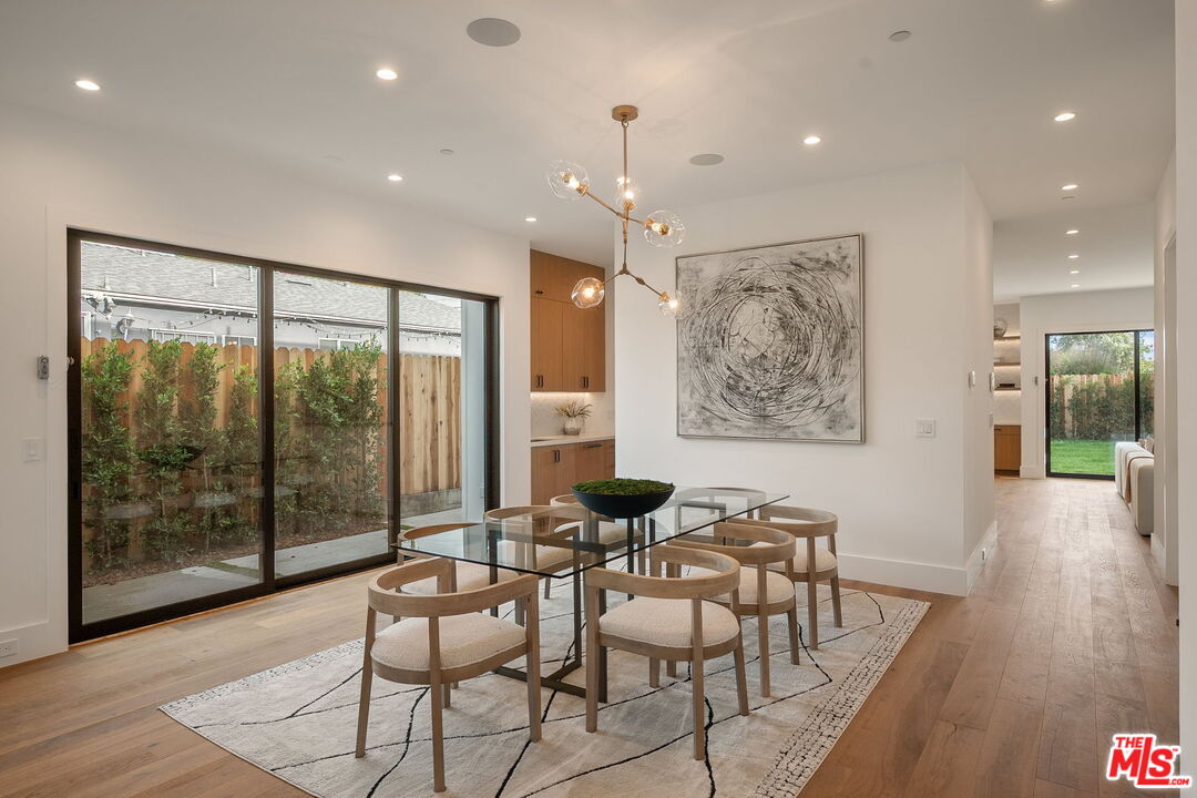 1742 Preuss Road Los Angeles, CA 90035 - Photo 9 of 50 a dining room with furniture and wooden floor