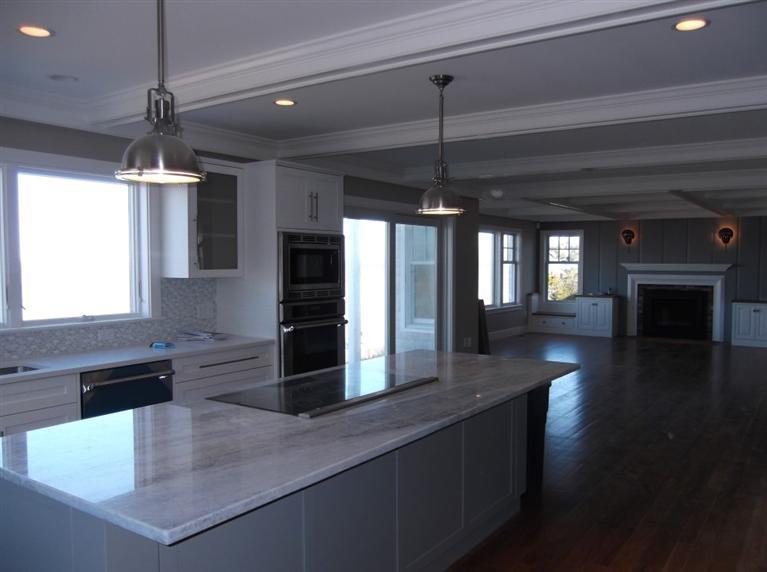 225 Sparrow Road Eastham, MA 02642 - Photo 15 of 29 a kitchen with stainless steel appliances granite countertop a sink a stove and a wooden floors