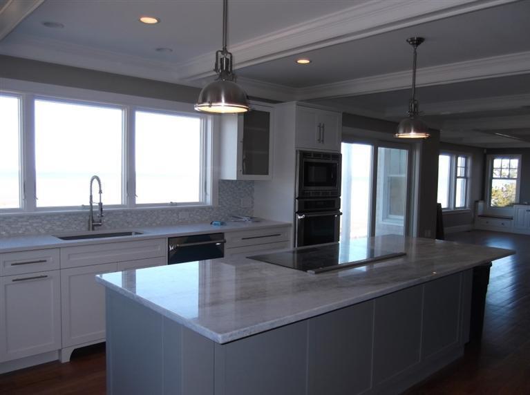 225 Sparrow Road Eastham, MA 02642 - Photo 17 of 29 a kitchen with stainless steel appliances granite countertop a sink a stove and a refrigerator