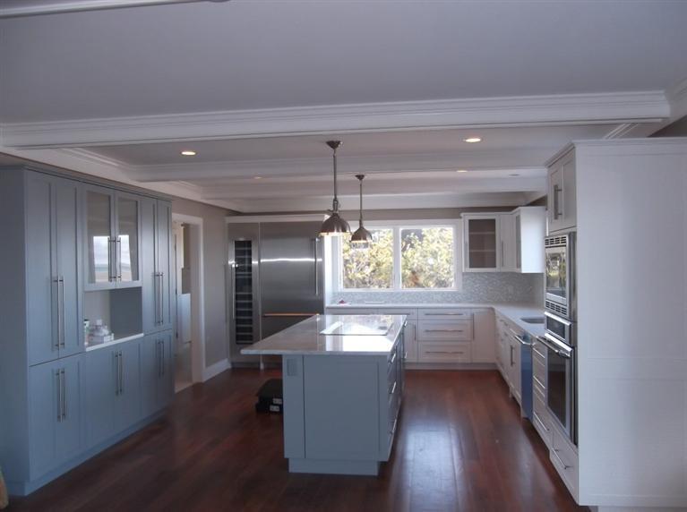225 Sparrow Road Eastham, MA 02642 - Photo 20 of 29 a kitchen with stainless steel appliances granite countertop a refrigerator a sink dishwasher a stove and white countertops with wooden floor