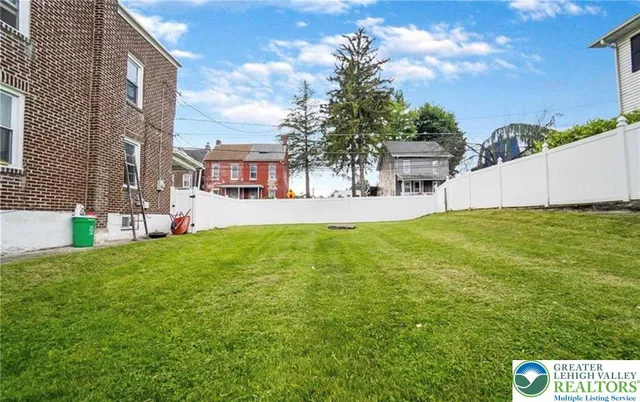 a view of house with outdoor space and porch