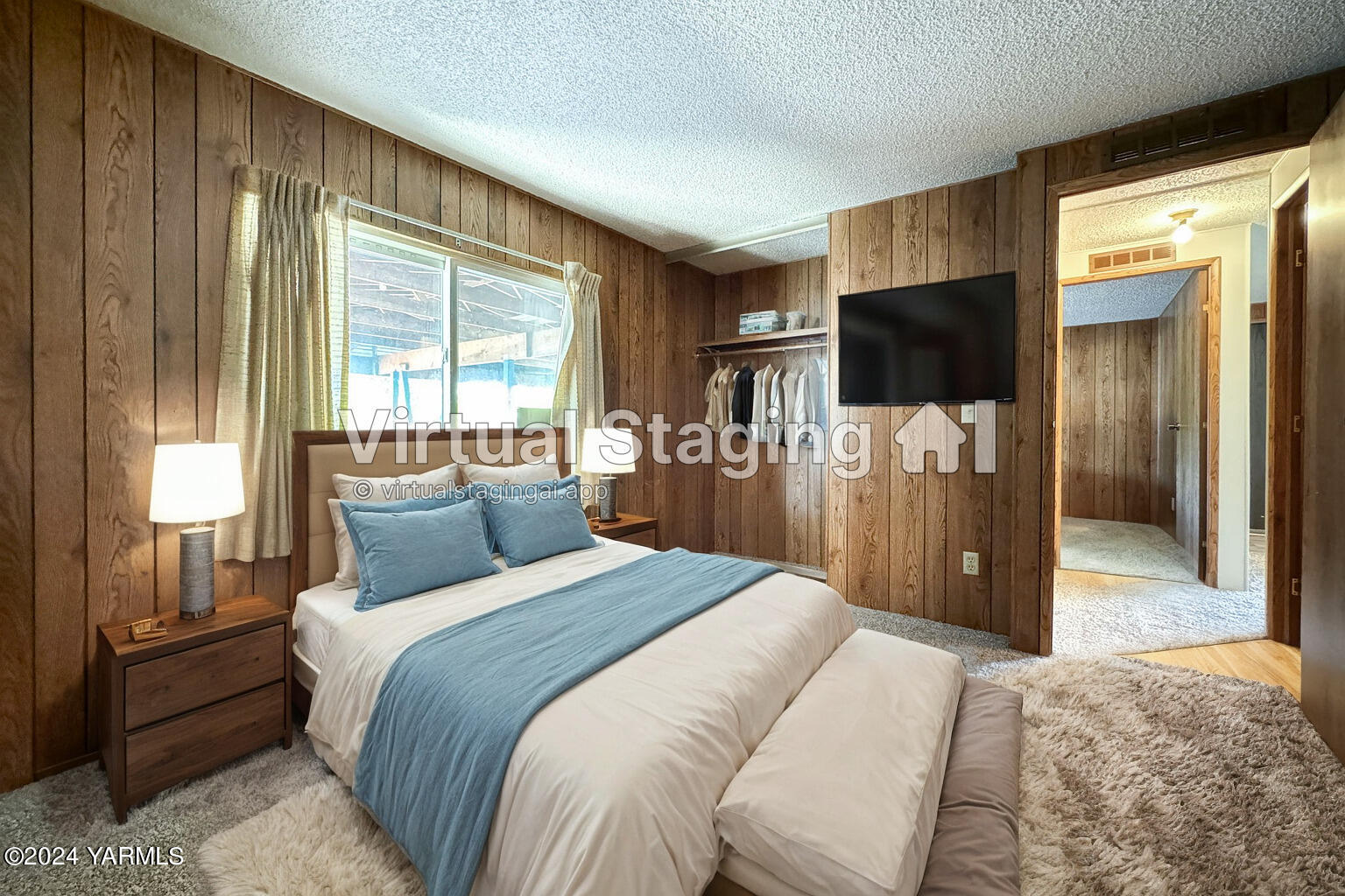 3701 Gun Club Road, Unit 54 Yakima, WA 98901 - Photo 13 of 17 a bedroom with a bed and a flat screen tv