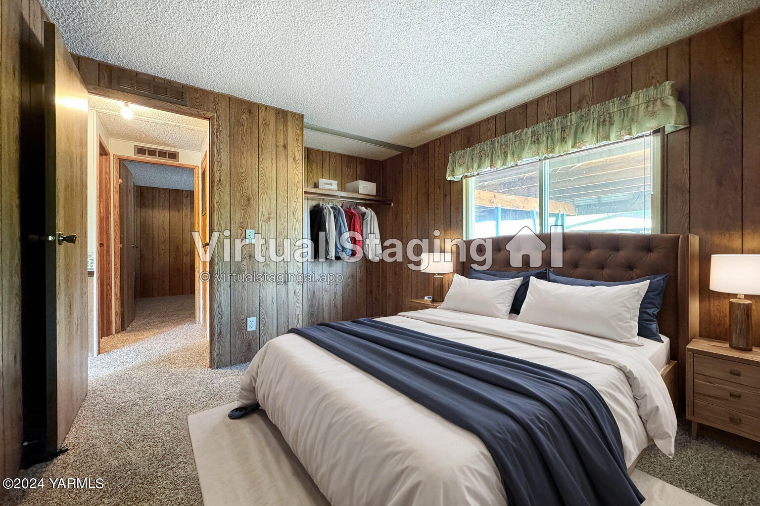 3701 Gun Club Road, Unit 54 Yakima, WA 98901 - Photo 14 of 17 a bedroom with a bed and a large window