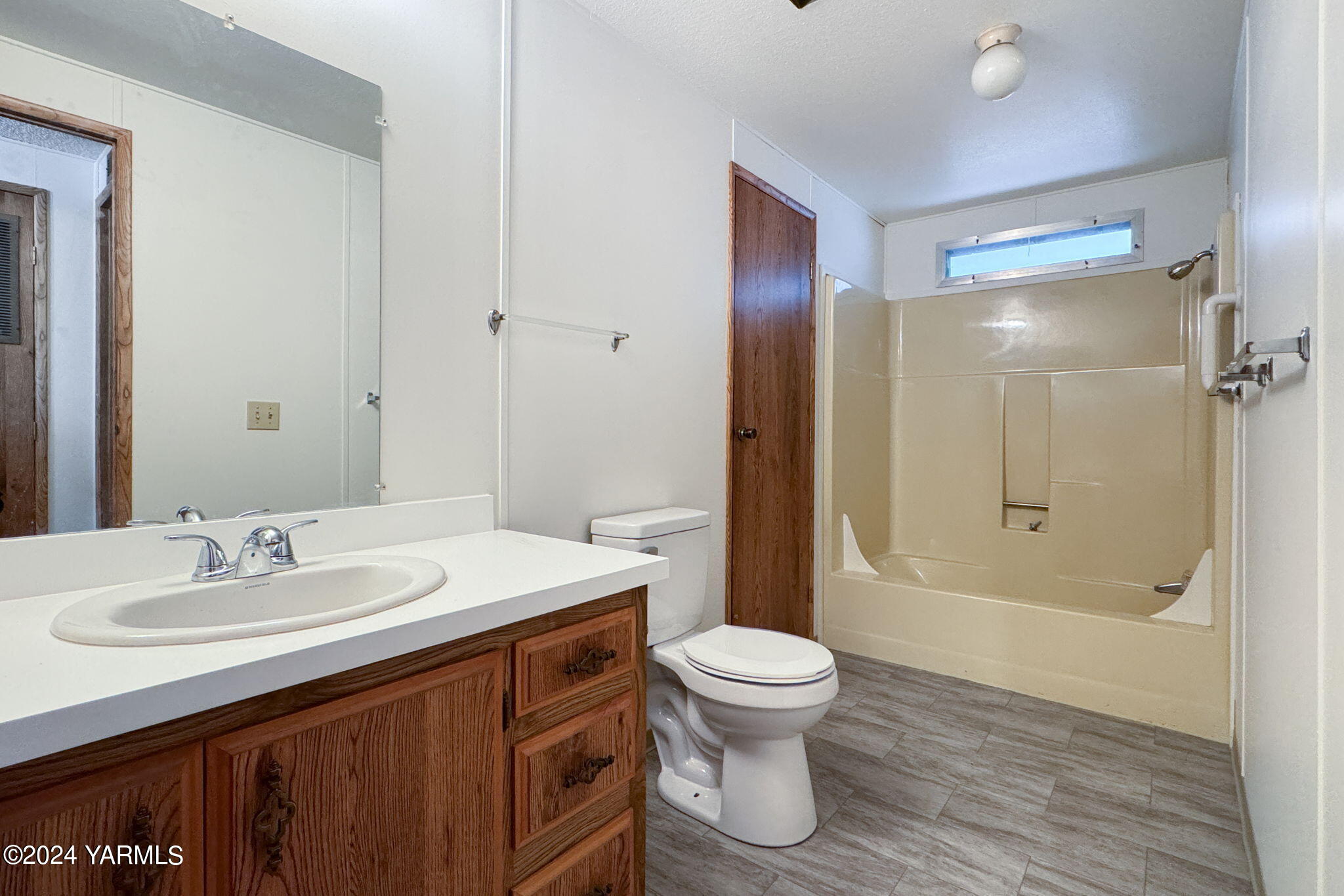3701 Gun Club Road, Unit 54 Yakima, WA 98901 - Photo 16 of 17 a bathroom with a sink toilet and shower