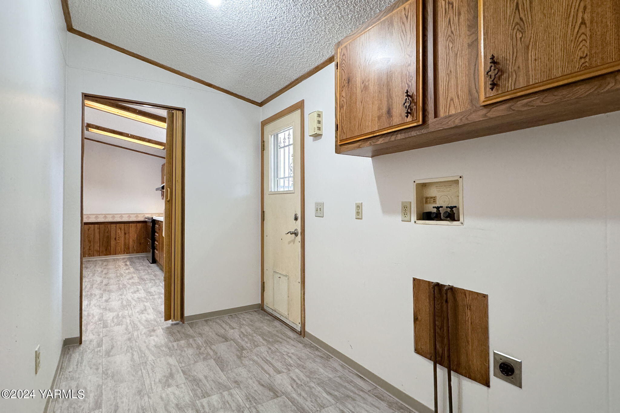3701 Gun Club Road, Unit 54 Yakima, WA 98901 - Photo 17 of 17 a view of a hallway with wooden floor and cabinet