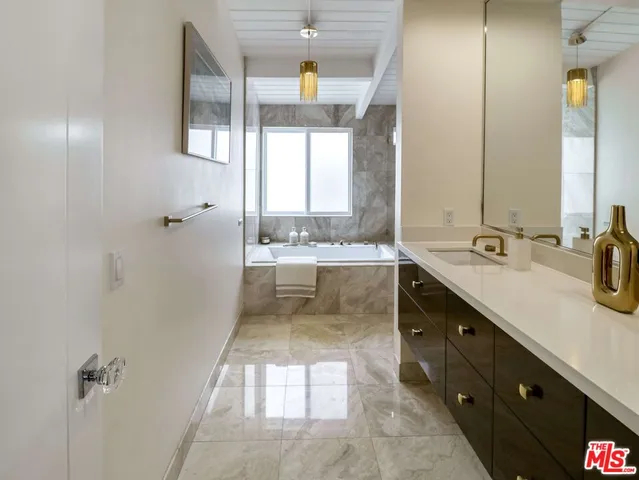 a bathroom with a double vanity sink mirror and double