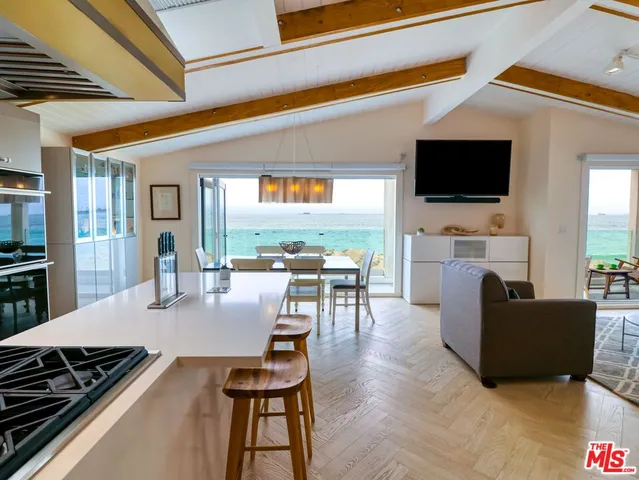 a living room with fireplace furniture and a flat screen tv