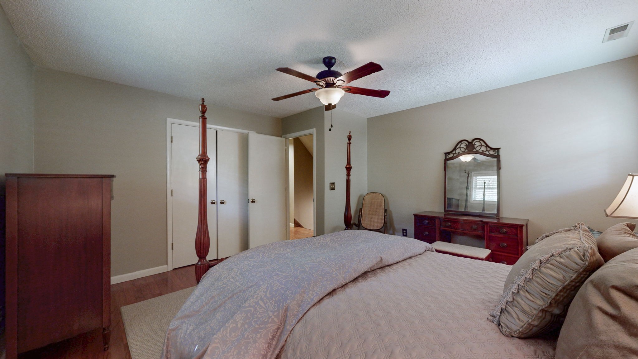 35 Davis Road Springville, TN 38256 - Photo 23 of 50 a bedroom with a bed and a chandelier