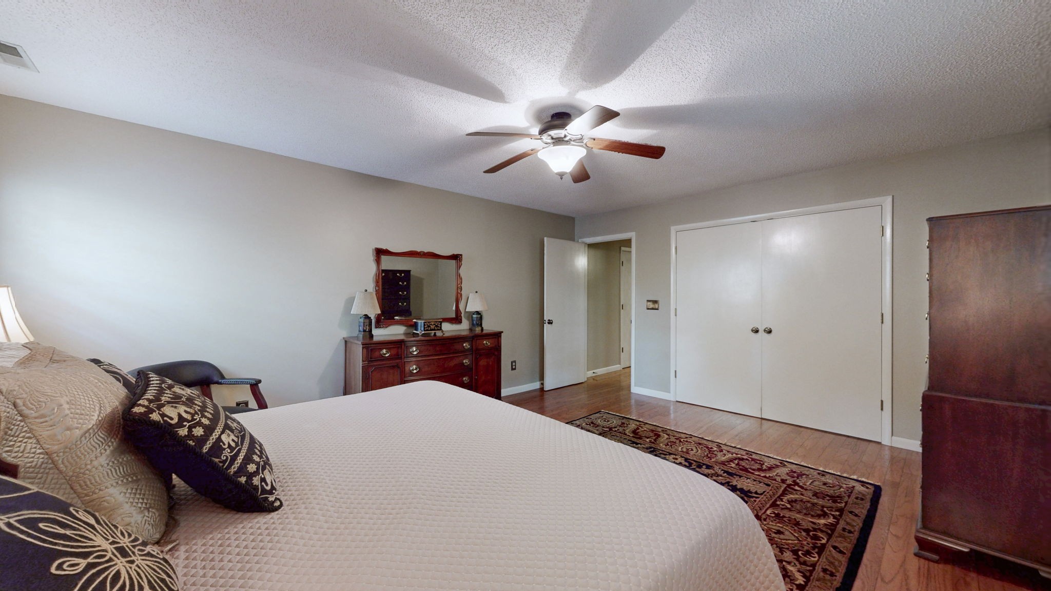 35 Davis Road Springville, TN 38256 - Photo 27 of 50 a bedroom with a large bed and a flat screen tv