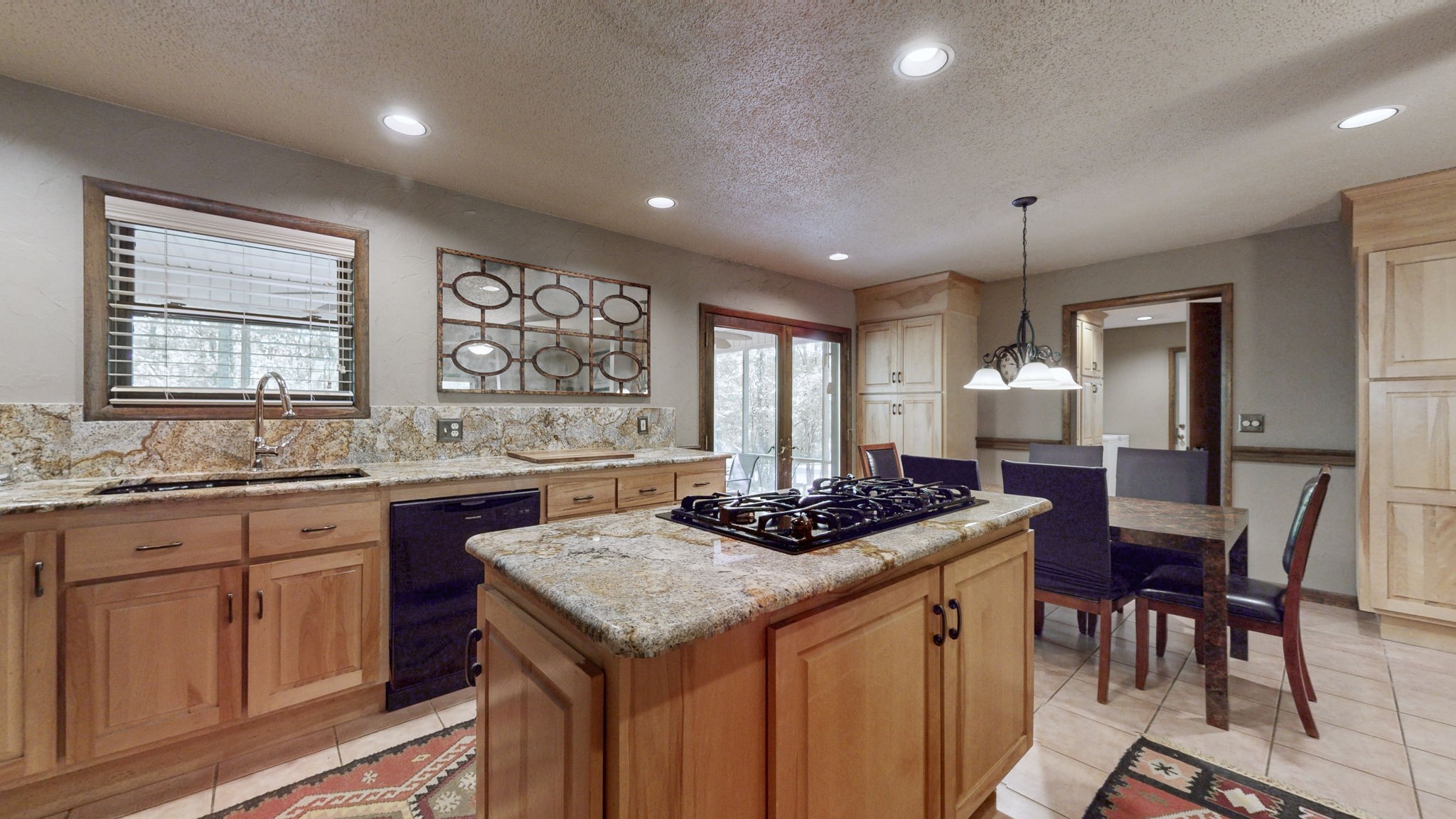 35 Davis Road Springville, TN 38256 - Photo 8 of 50 a kitchen that has a sink a stove dining table and chairs