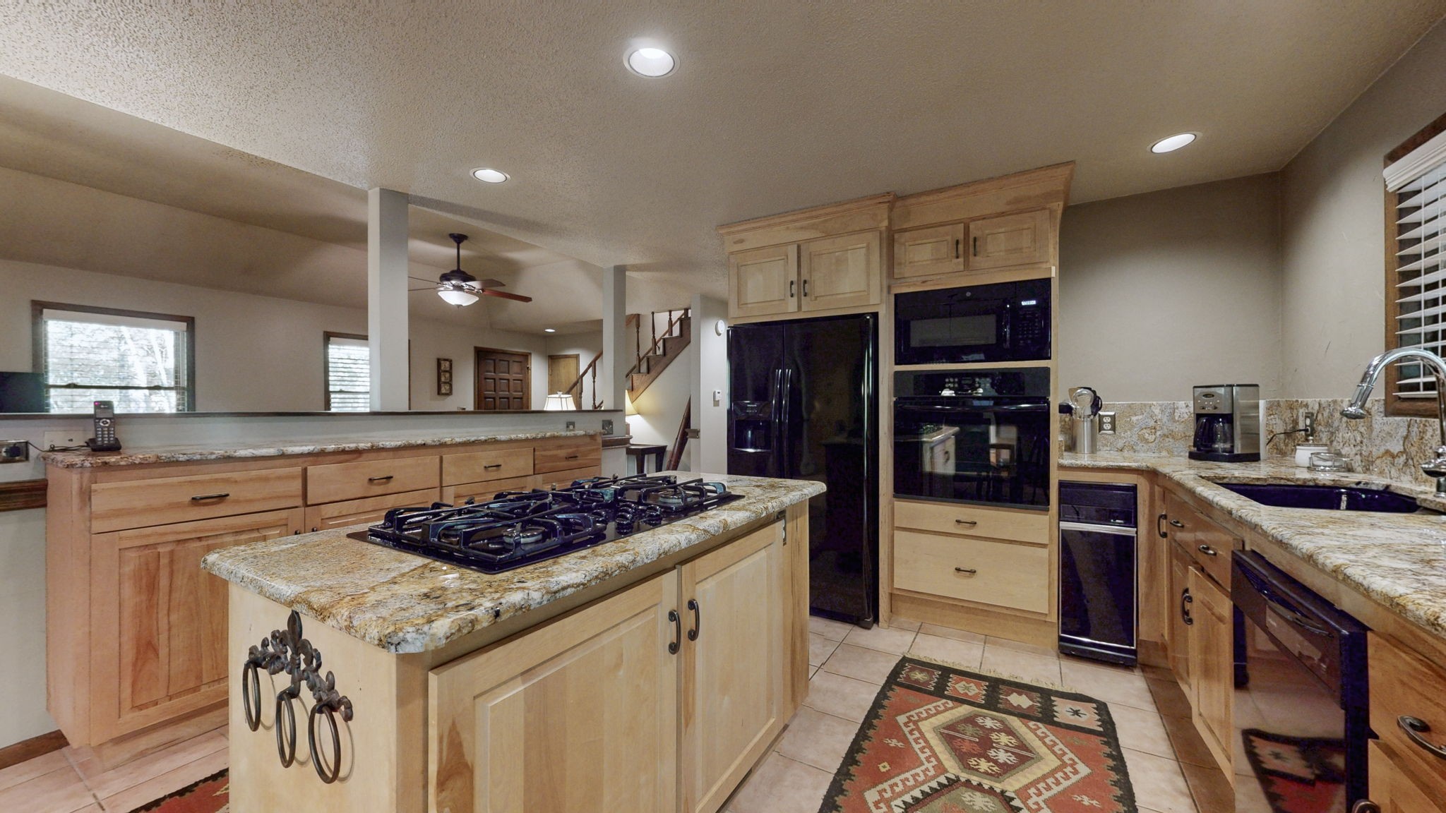 35 Davis Road Springville, TN 38256 - Photo 10 of 50 a kitchen with stainless steel appliances granite countertop a stove refrigerator and cabinets