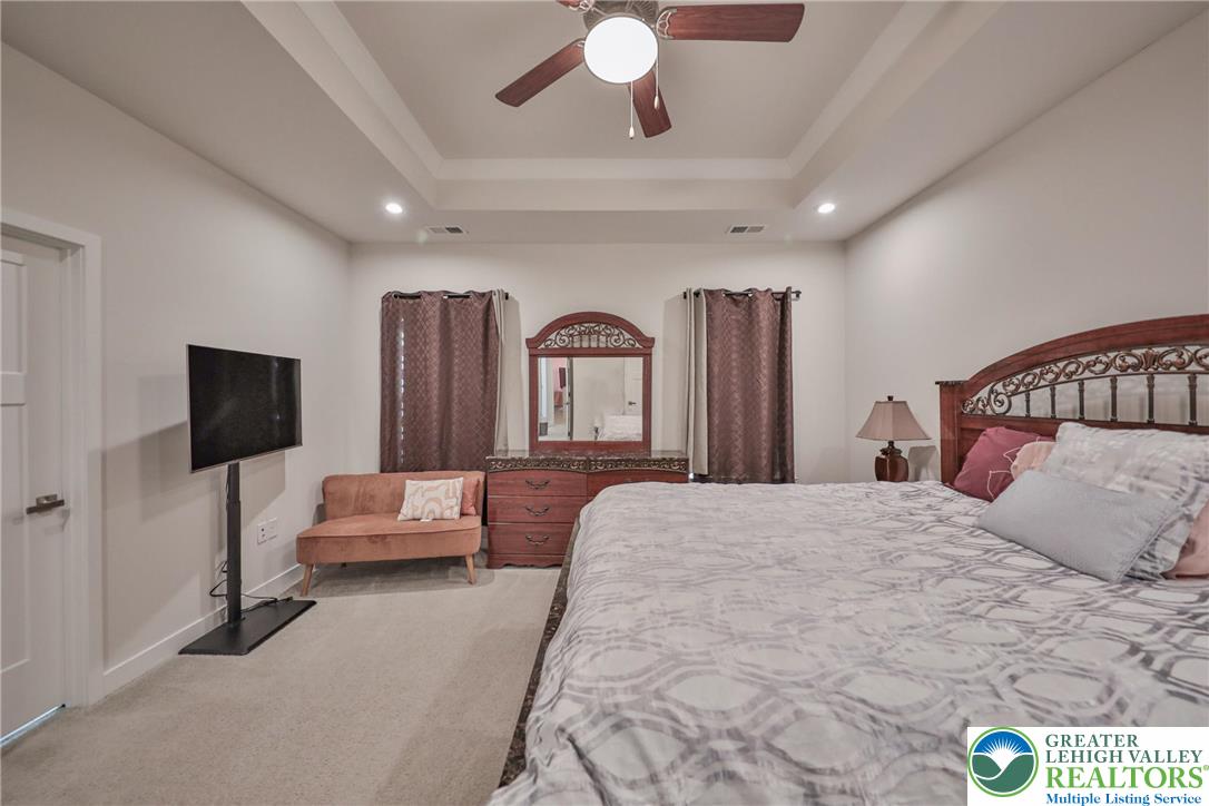 2364 Raya Way Easton, PA 18045 - Photo 16 of 40 a bedroom with a bed and a chandelier