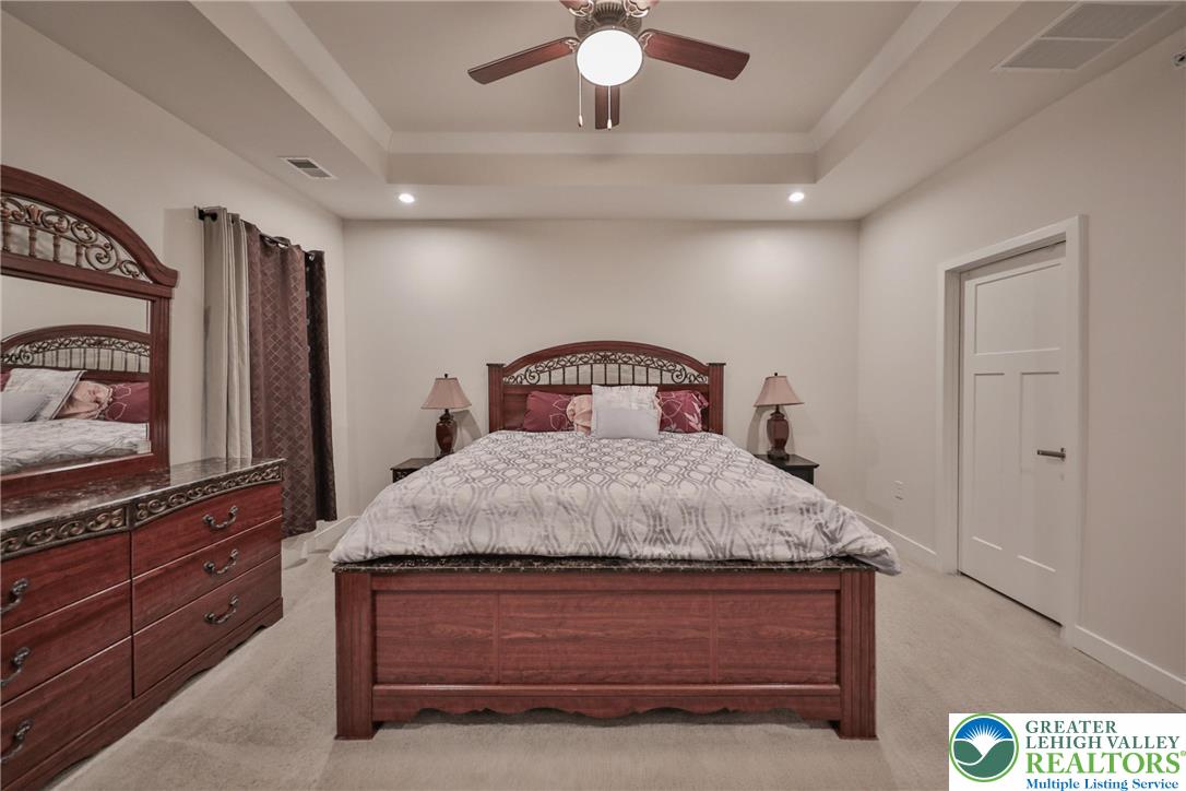 2364 Raya Way Easton, PA 18045 - Photo 17 of 40 a bedroom with a bed and a flat screen tv