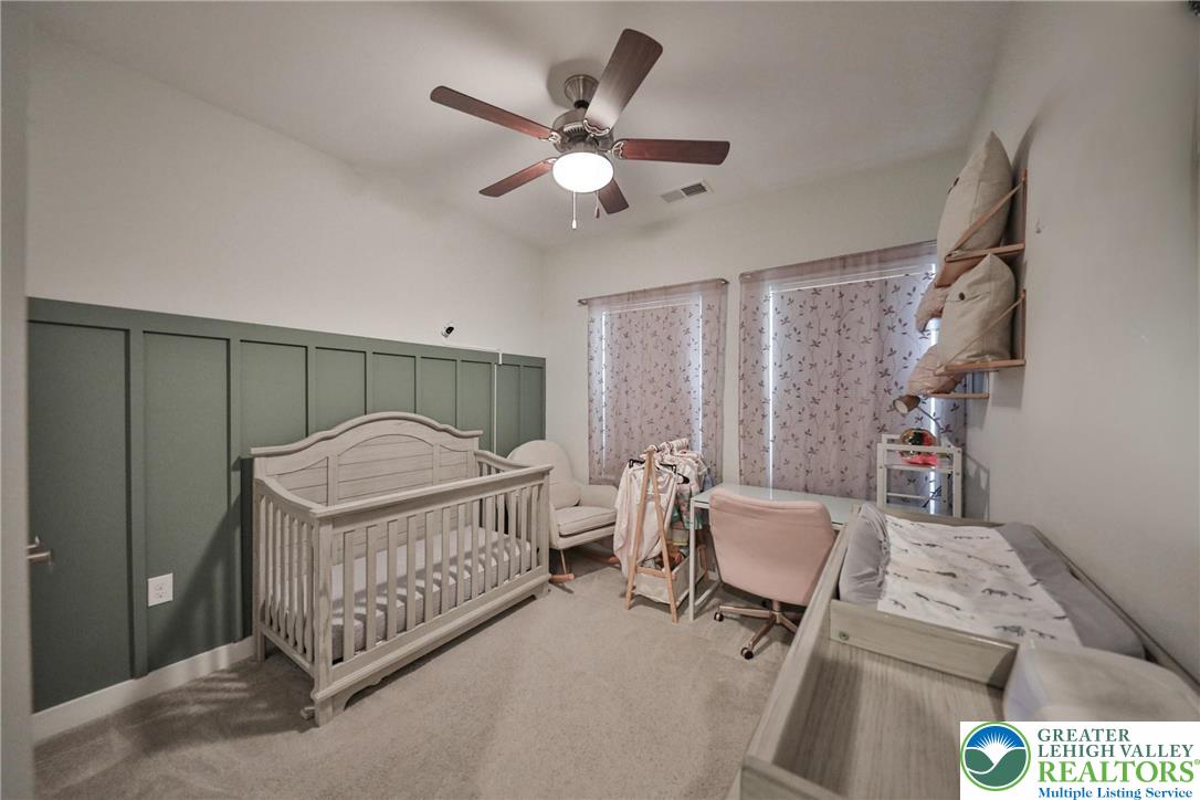 2364 Raya Way Easton, PA 18045 - Photo 25 of 40 a bedroom with a bed and a chandelier