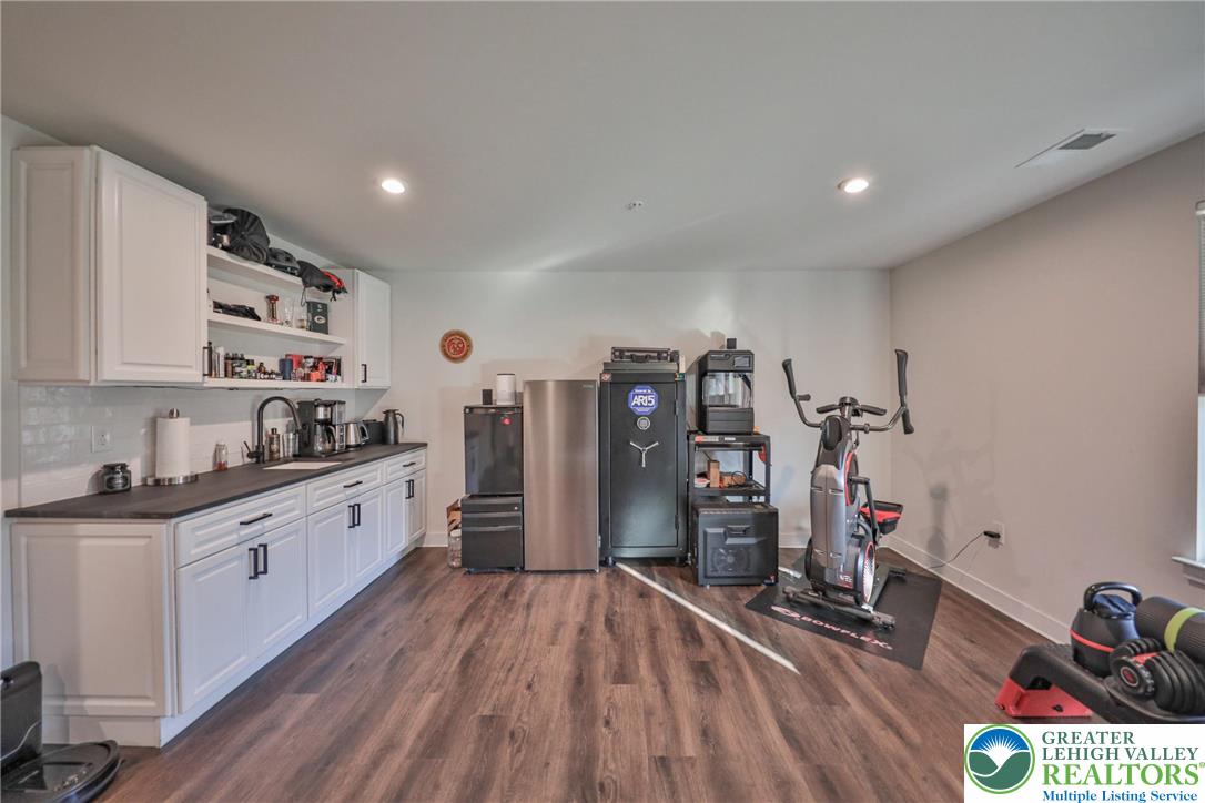 2364 Raya Way Easton, PA 18045 - Photo 31 of 40 a kitchen that has a lot of cabinets and wooden floor