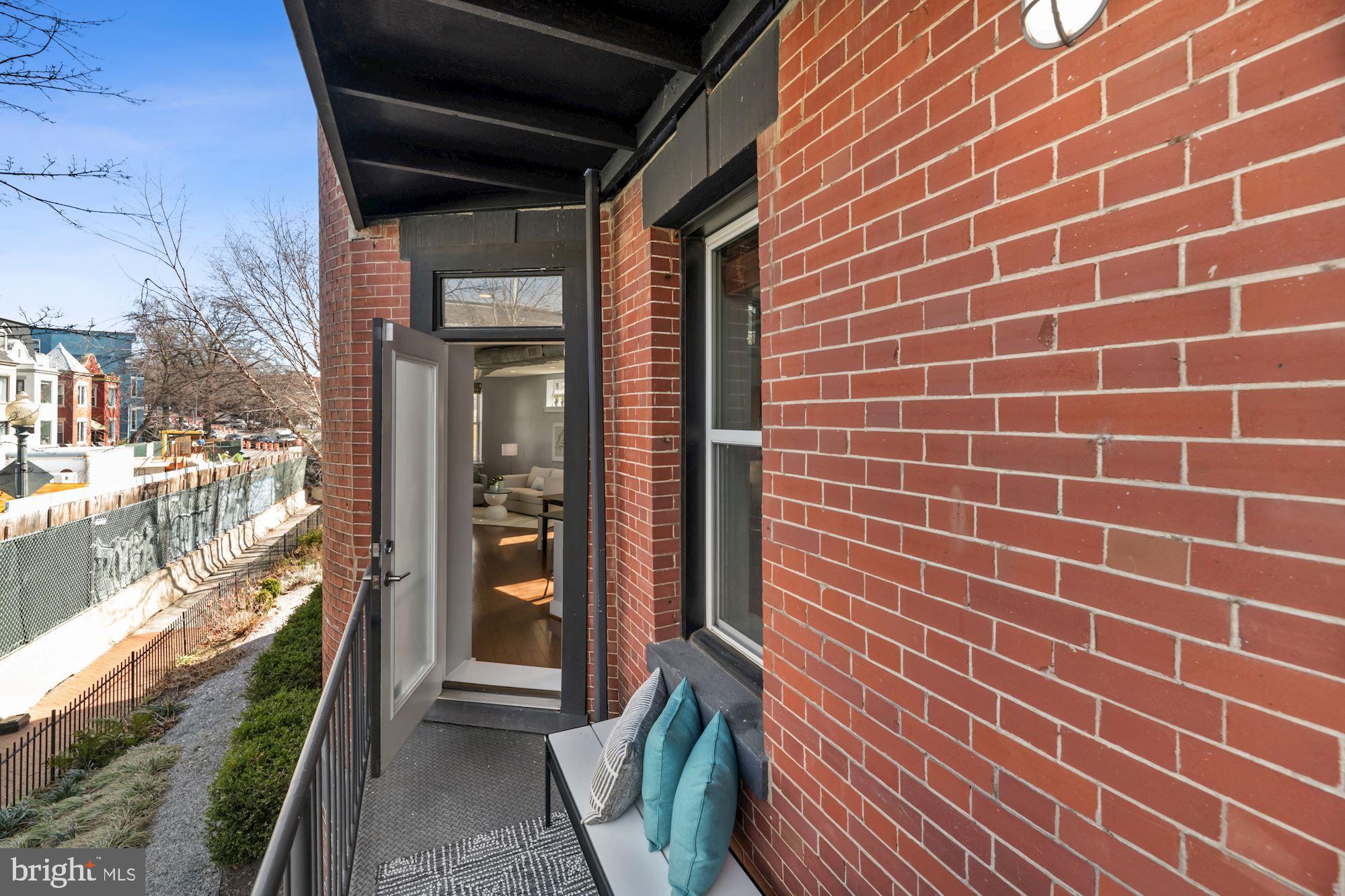 143 Rhode Island Avenue Northwest, Unit 3 Washington, DC 20001 - Photo 16 of 18 a view of a brick wall from a hallway