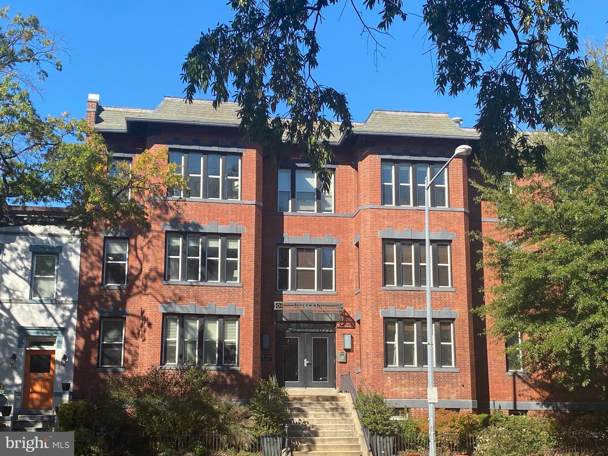143 Rhode Island Avenue Northwest, Unit 3 Washington, DC 20001 - Photo 2 of 18 a front view of a residential apartment building with a yard
