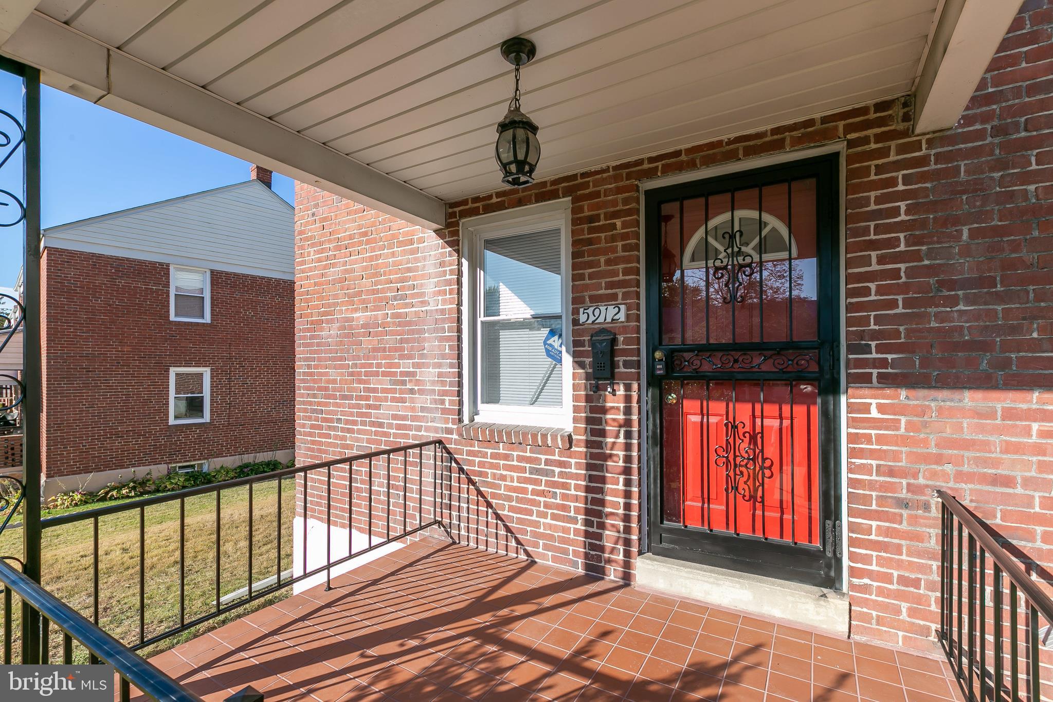 5912 Glenkirk Road Baltimore, MD 21239 - Photo 2 of 32 Inviting tiled front porch