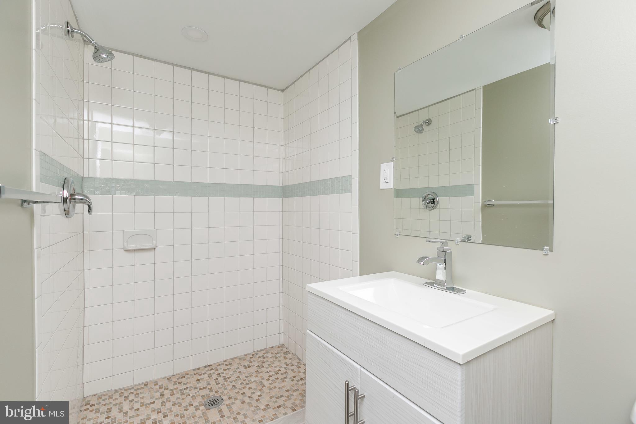 5912 Glenkirk Road Baltimore, MD 21239 - Photo 27 of 32 Lower level full bath with shower