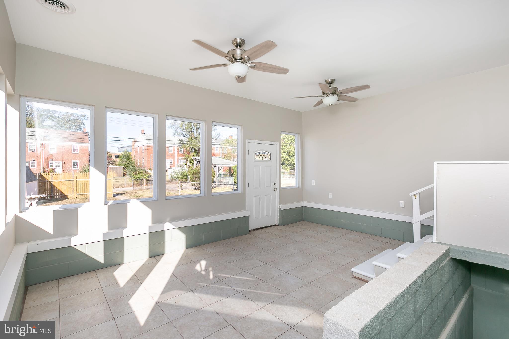 5912 Glenkirk Road Baltimore, MD 21239 - Photo 30 of 32 4 season family room has ceramic tile floor