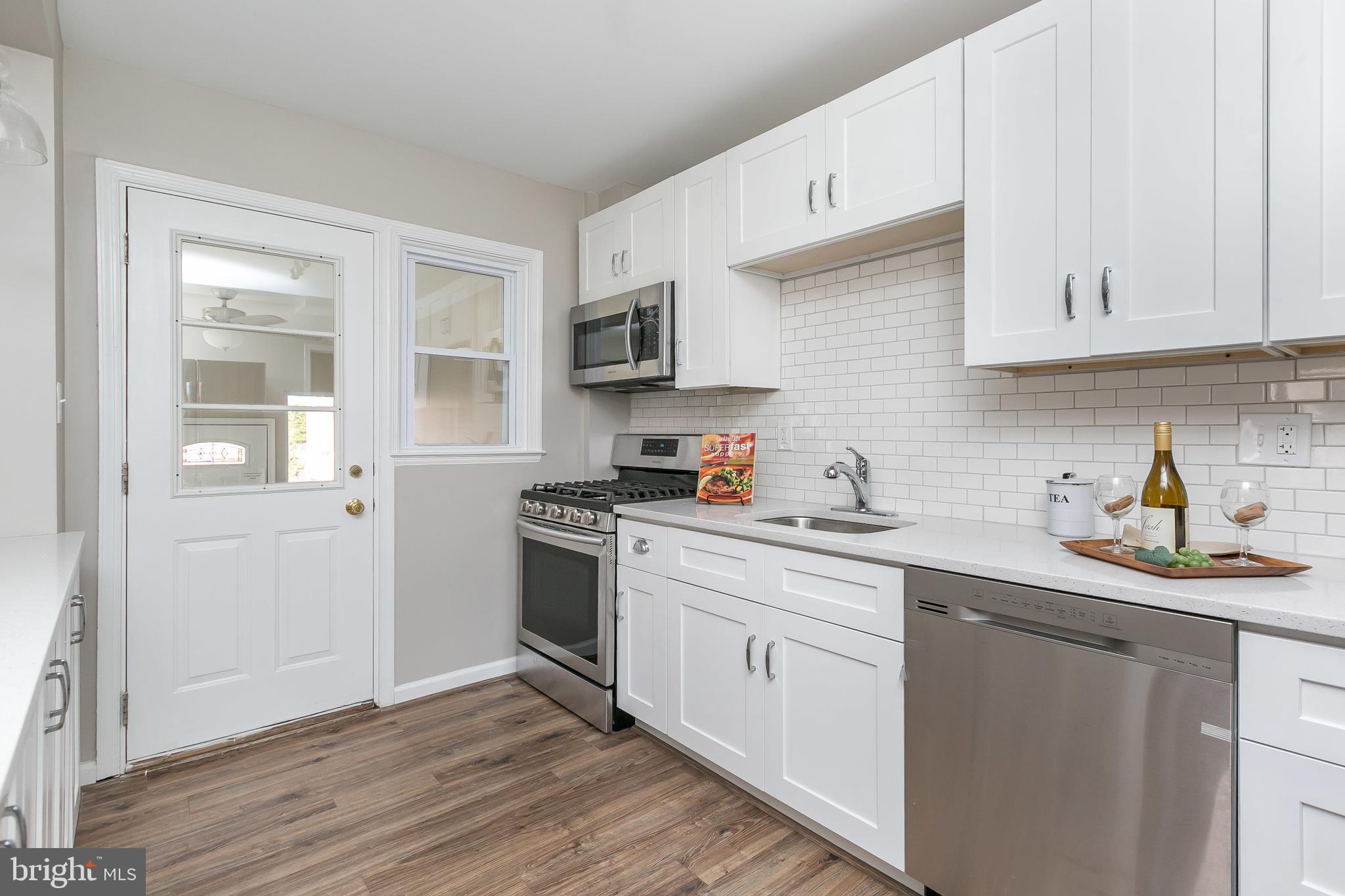 5912 Glenkirk Road Baltimore, MD 21239 - Photo 10 of 32 sleek white kitchen