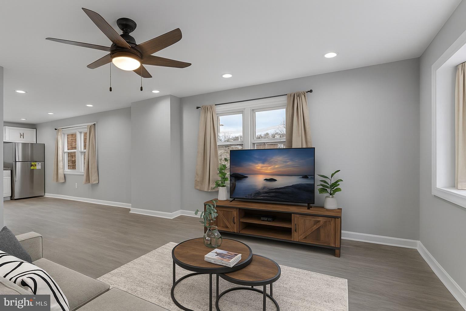 1006 Butler Street Chester, PA 19013 - Photo 11 of 31 a living room with furniture and a flat screen tv