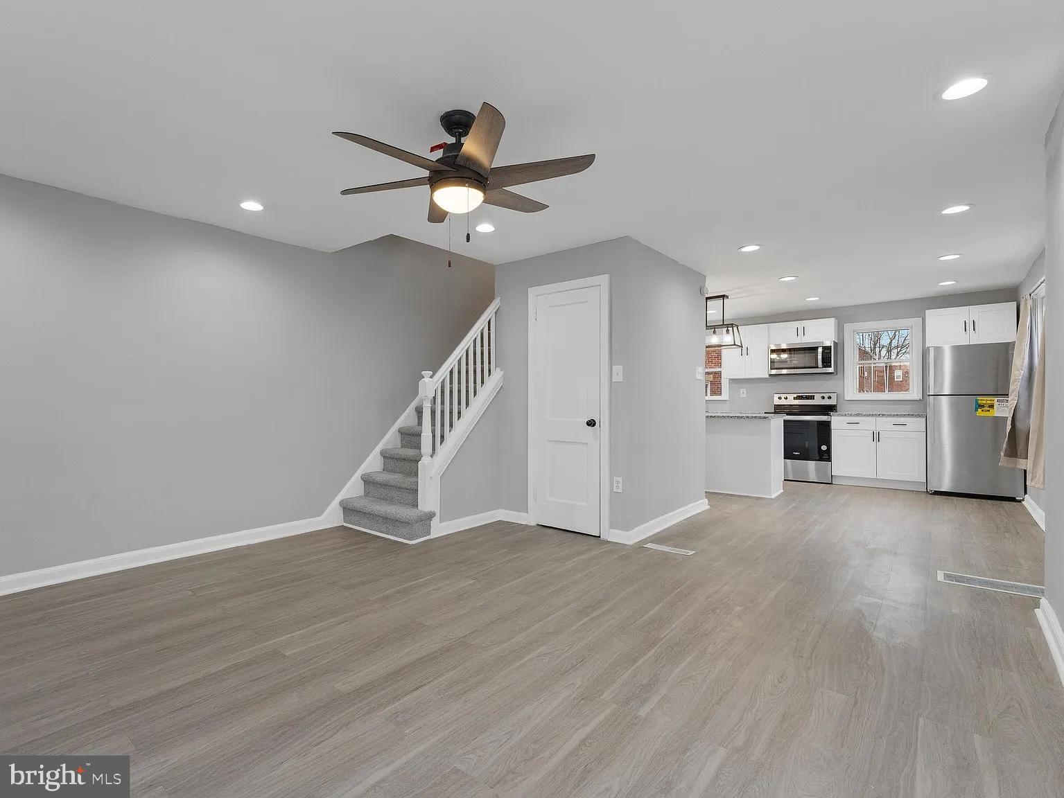 1006 Butler Street Chester, PA 19013 - Photo 12 of 31 a view of an empty room with a window and wooden floor