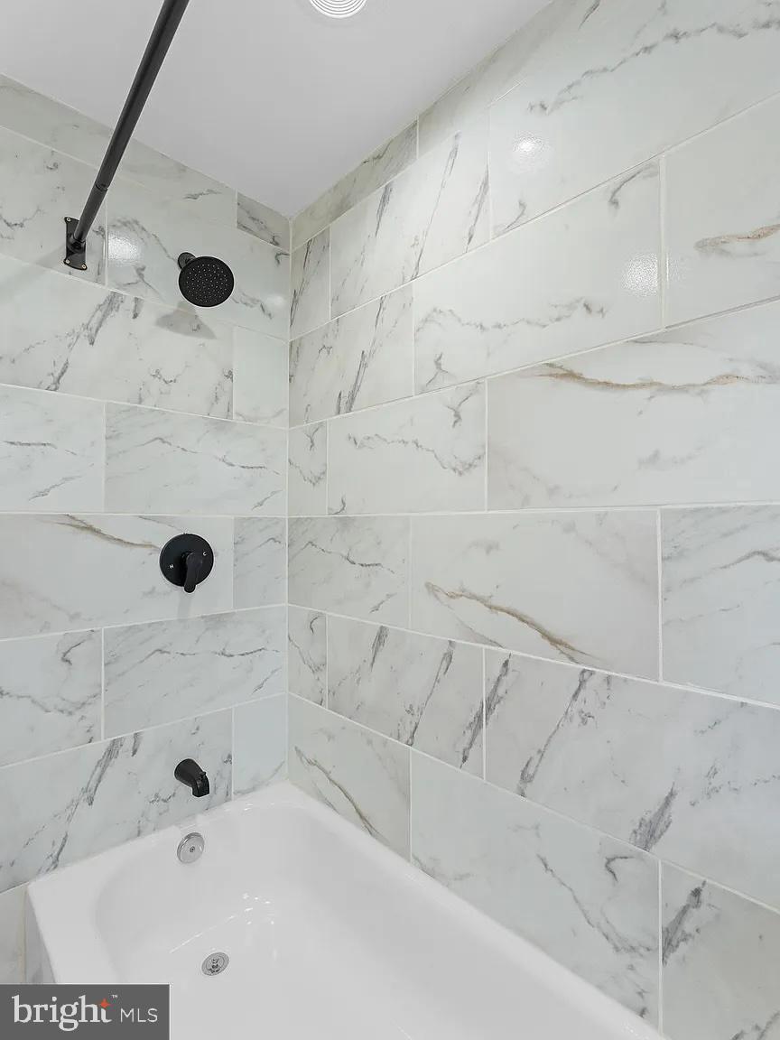 1006 Butler Street Chester, PA 19013 - Photo 21 of 31 a bathroom with white shower