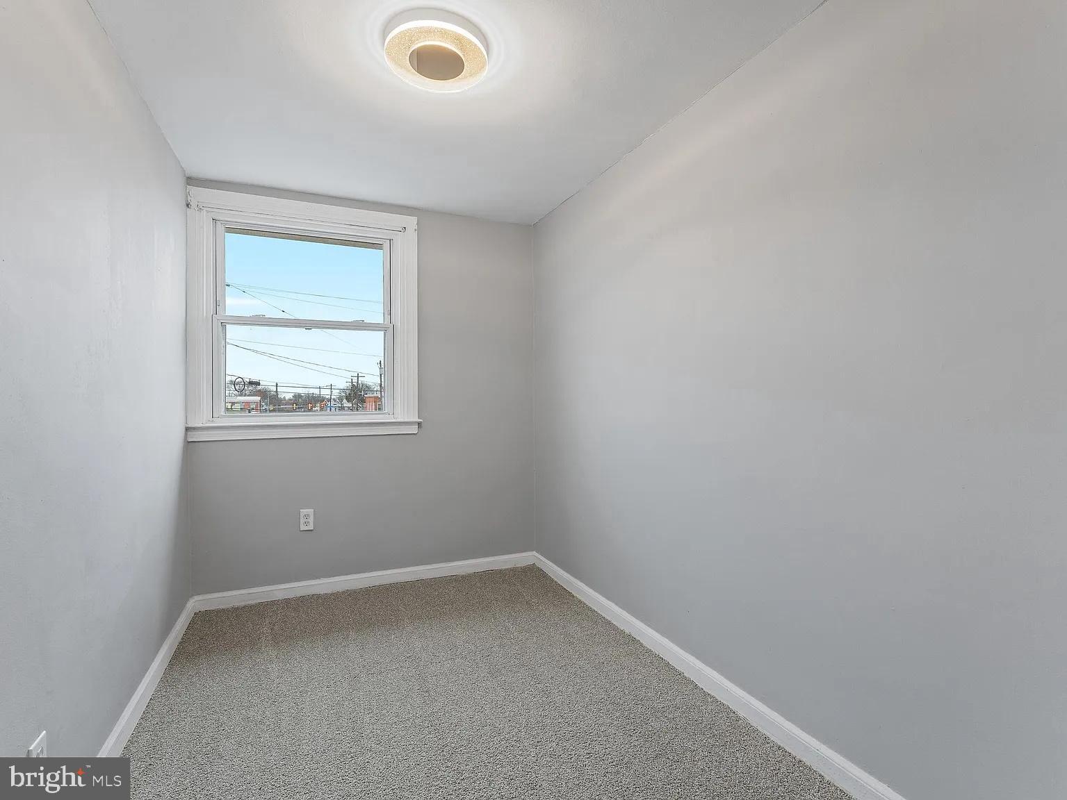 1006 Butler Street Chester, PA 19013 - Photo 26 of 31 an empty room with a window