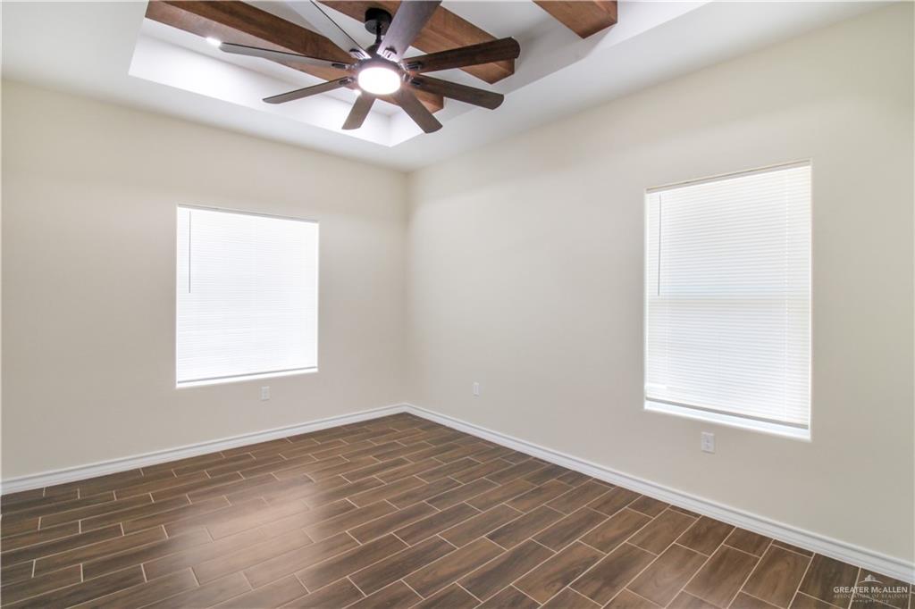 2126 Trinity Street Donna, TX 78537 - Photo 11 of 15 an empty room with a window and a fan