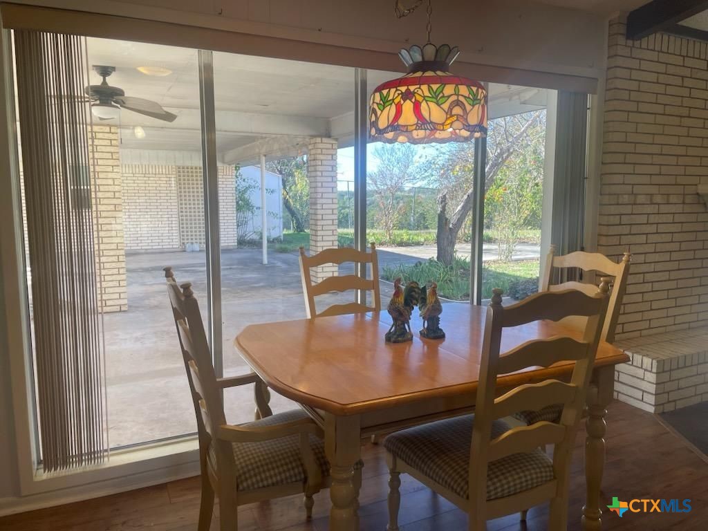 104 Skipcha Trail Lampasas, TX 76550 - Photo 13 of 34 a view of a dining room with furniture wooden floor and a potted plant