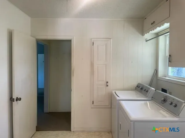an empty room with closet and a bathroom