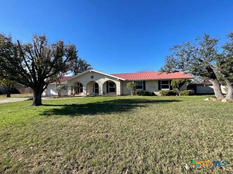 104 Skipcha Trail Lampasas, TX 76550 - Photo 2 of 34 a front view of a house with a yard